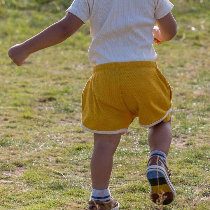 Pantalones cortos Run Around Oro - Olokuti